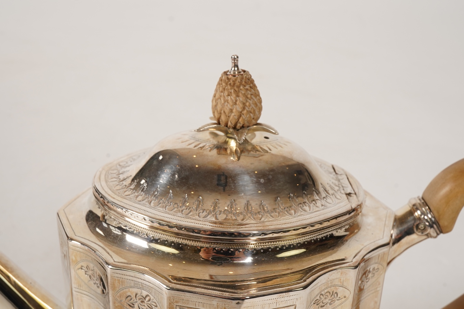A George III bright cut engraved silver teapot and matching stand by Robert Hennell I